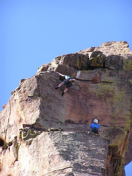 At the end of the crux on the 3rd pitch. South Crack (5.11c) can be seen to the left.