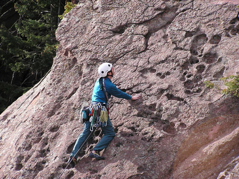 Tim is checking out the cool rock on the east ridge of Yodelings moves.