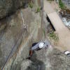 Chuck just about done struggling with the finish to P3. As with P2, the crux is not the overhanging layback, but getting established on the lower angle rock above.  The piece above Chuck is a good green Alien. A good idea to keep the rope from running over the top cams if the second should fall. Shortest approach in Boulder! That's our car below. Just like the old days when you could park at the base of the Bastille.