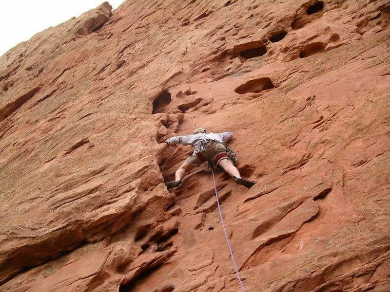 Climbing just above the first bolt.