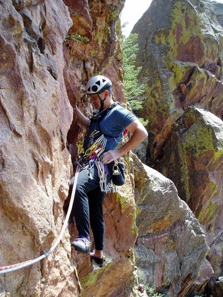 Chuck starting P3 10a. The route goes over the hang above Chuck then about 15' to a bolt that's difficult or impossible to see from here. We made the big mistake of moving down and right ito Pigeon Crack. The Vertigo Roof is barely visible at the far right of the photo.