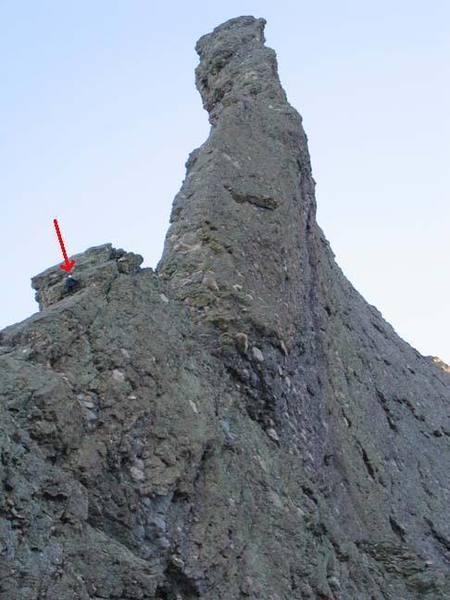 The prow as viewed from near the end of the approach. The red arrow points to a climber in the party ahead of us free soloing the pitch before the crux.