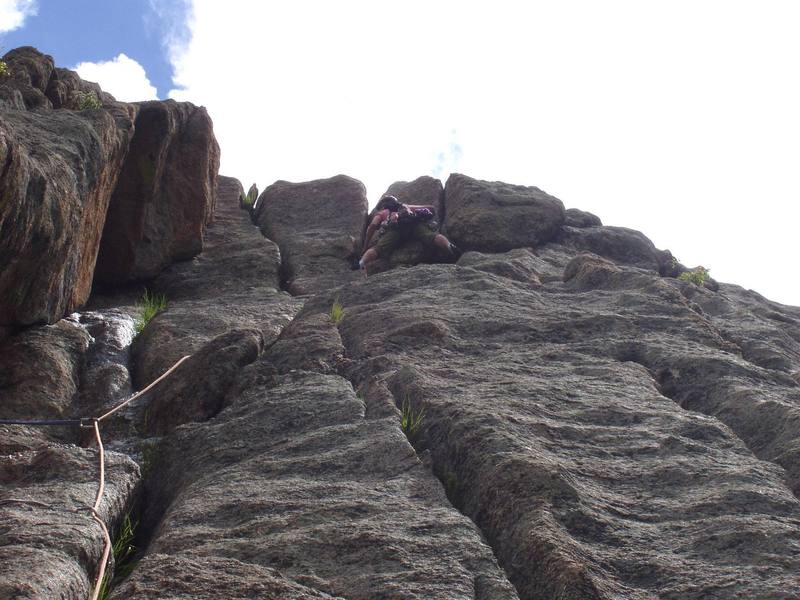 Christa is about to pull the crux on pitch 3.