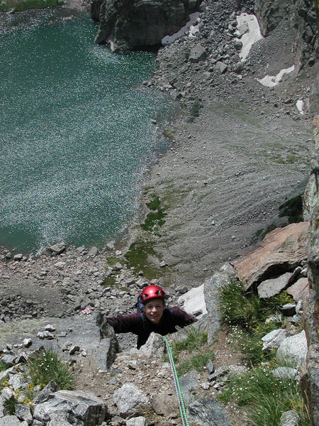 Christa Cline approaching the big ledge at the top of the crux pitch.