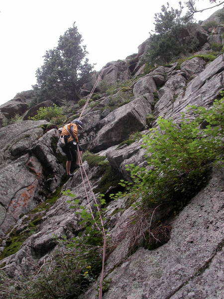 Yvonne D'Andrea rappelling to the big terrace below Lost Highway. From the rappel, walk about 100' right to get to the start of the route.