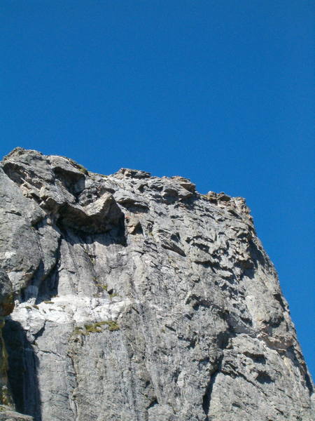 Climber, Craig Blankenship<br>
Photographer, Dan Nifong from the midway ledge on the First Buttress.<br>
Date, 8/6/04.<br>
<br>
Of Course, this is the Crux and the exposure is breathtaking.