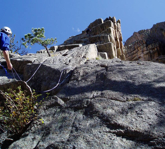 After the last crux. Lenny Miller belaying. Photo by Chuck Graves.