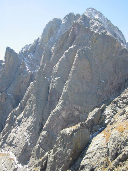 Another view of the north pillar from the NE. The pillar is the steep, sustained ramp with the sun hitting the arete of the ramp.