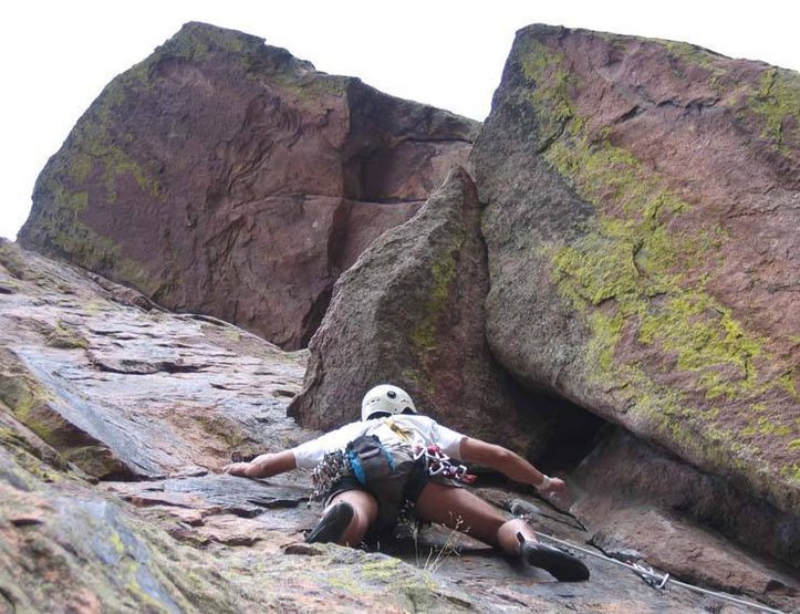 Approaching the roof on pitch 2 (done as a 3 pitch climb). The crux on pitch 3 climbs out to the V notch at the far left of the skyline.