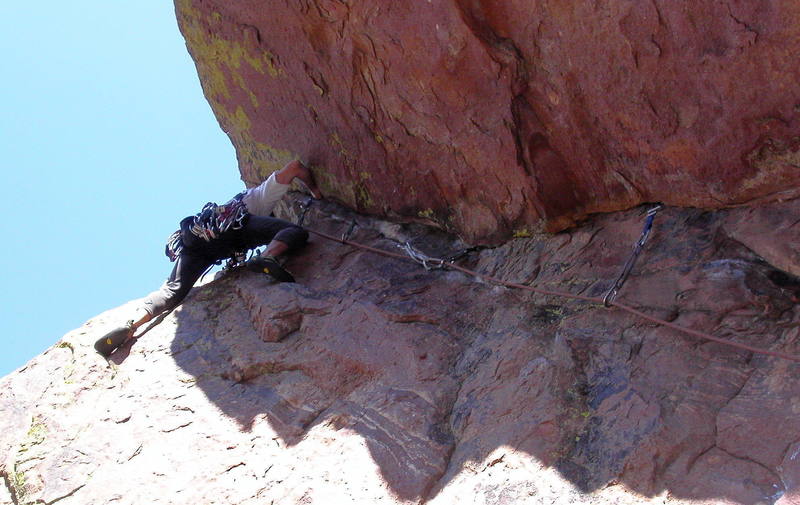 Peter Dillon at the crux step left on the last pitch of Allosaur.