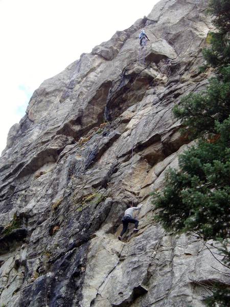 Chuck is nearing the top of P1. I am belaying at the top of P2 after linking P1 and P2. You can rap to the ground from the P2 belay with a 70m rope.<br>
<br>
Photo by Paul Rezucha.
