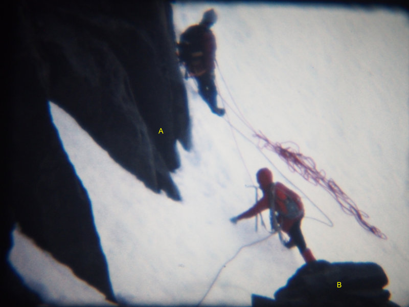 Photo2 - MJ Cross joins Roy Preshaw at the belay at the start of the ramp. Note formations labeled "A"& "B" and the match to the same labeled formations in photo1 taken from Turret. One rope leads to me, already on the "ramp". (from Super-8 movie)