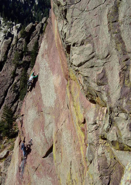 The P2 slab, taken from Anthill Direct. You can peer around the corner here to scope out Jules Verne. The slab is about 5.8. After turning the arete to the left at the top of the slab, there is a airy and steep 10b section with climbing a bit above a small but good nut.
