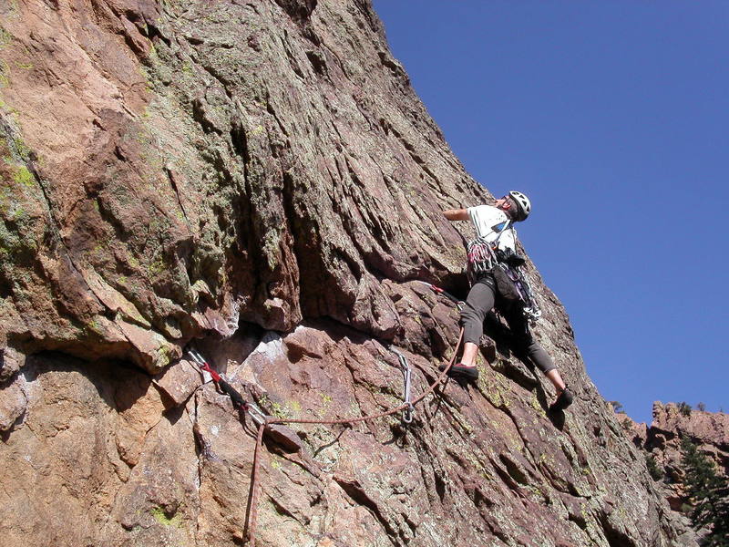 Peter Dillon at the end of the traverse to the right on pitch 2. From here, Peter will climb up and angle back left onto a ramp.