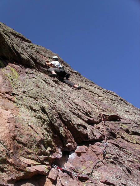 Peter Dillon getting onto the left-angling ramp on pitch 2. There's a 5.4 step-up move here, then an easy runout to the anchor.<br>
<br>
This move is more dangerous for the follower, since they would take a big swing if they fell off.