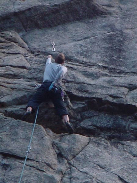 Brent Pohlmann just below the crux on the first <br>
pitch of Divination.