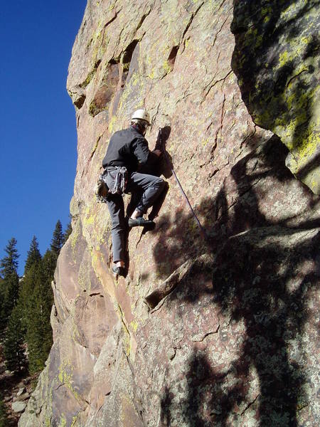 Moving left at the first bolt. The flakes here are very friable.<br>
<br>
Photo by Ken Heiser.