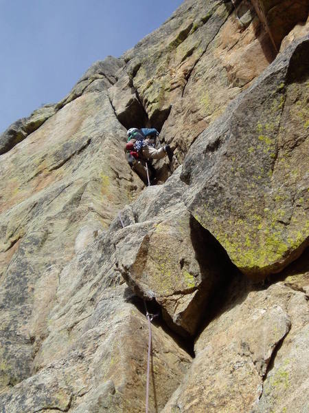 Stemming and backstepping the corner/chimney that leads to the roof. Interesting moves, but not that hard.