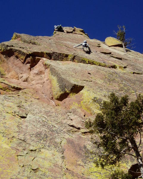 At the upper crux at the 5th bolt. After that it's about hard 5.9. The climber at the top is on Moonlight Drive and is trying to finish directly up the arete.
