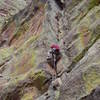 In the middle of the first crux. There is a good 0.75 Camalot above Luke's waist. Standing up from here is precarious.
