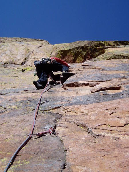 Chuck climbing the crux to the left of the corner. This is maybe 2 letter grades easier than climbing the face just right of the corner, but you have to get here first, and that's hard.