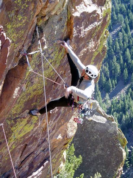 Chuck casually resting with a heel hook. You can pull hard with your leg and make a long reach to the lip. I've done it this way, but this time I found it easier to work the crack and face holds just right of the crack.