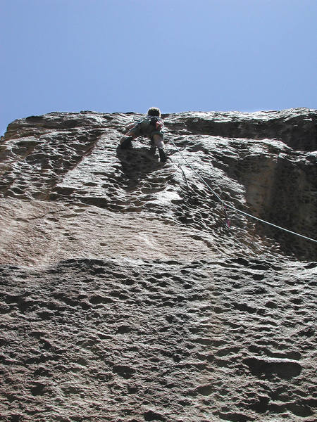 Mike Amato enjoys the huecos on the moderate upper section of the route.