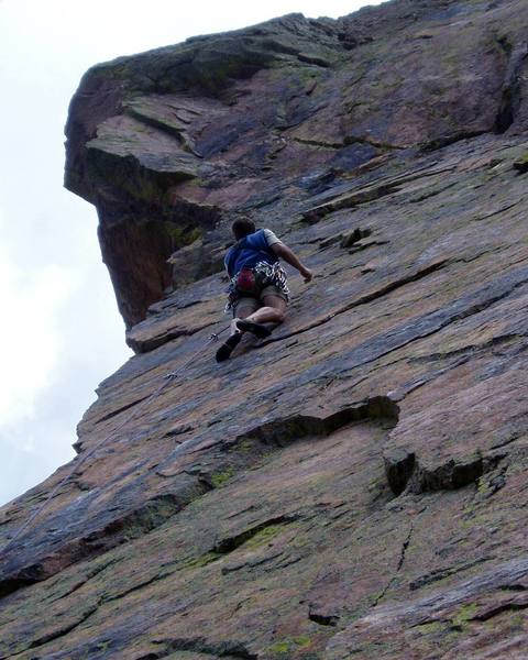 At the 3rd bolt after the step up move. We moved straight left to the arete from here to a thin layback flake (that takes a green Alien) and then up the arete. These moves left were the crux of the route for me following. Very thin feet then layback with no feet. It looks like you could climb straight up from where Vern is.