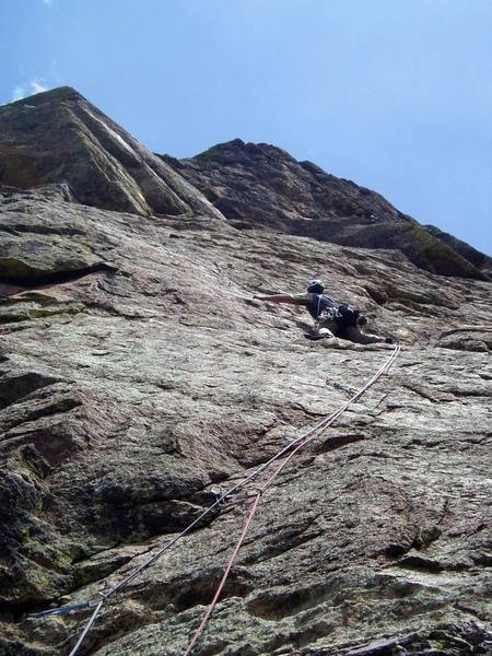 Beginning the leftward traverse across the slab. This slab section is really fun. Occasional bolts with some gear in between. Slightly run out, but not too hard. There is one particularly hard move at the very end, just before you get to the ceiling that starts the crux section.