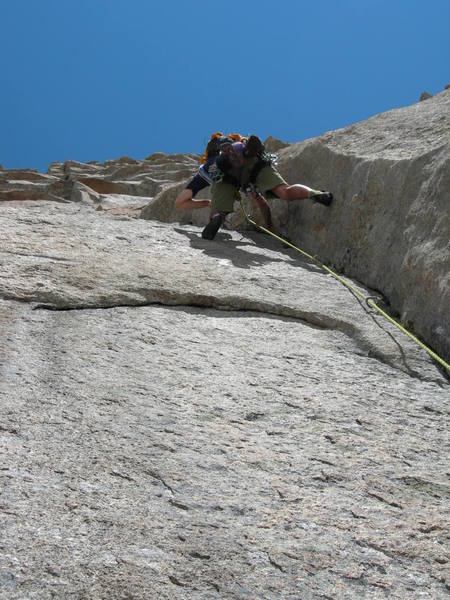 Justin doing battle with the 4th pitch. Another beautiful dihedral with sturdy 5.11 climbing and hard fought gear.