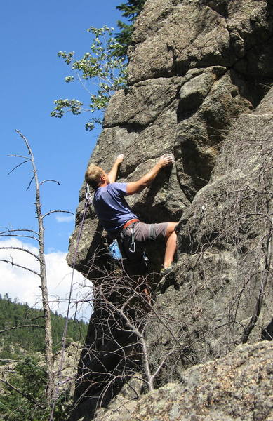 Brent Pohlmann on the lower roof of Memory of Trees. The roof can be turned on the right, as Brent is doing, or on the left.