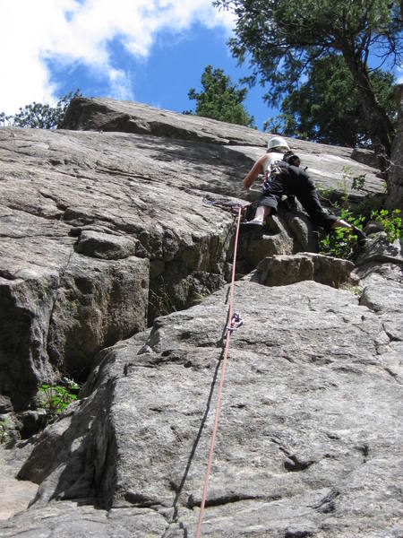 Nickie Kelly stepping left onto the upper slab on Road to Isengard.