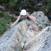 Nickie Kelly on the airy arete on p1 of Ancient Light.