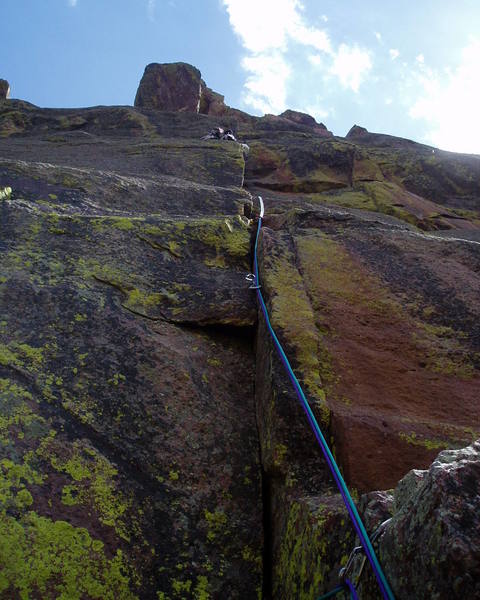 Not exactly an action shot, but this shows the route from the belay. Notice Lenny's twin 7.x dental floss ropes.<br>
<br>
Photo by Lenny Miller.