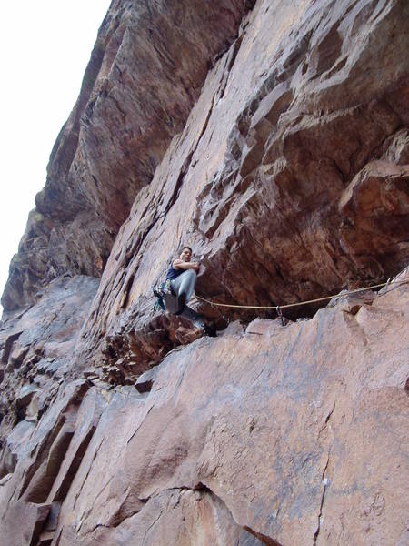 Pulling the ceiling on big handholds. Soon as you step over you're in balance and can get good gear to protect somewhat difficult move to clip the bolt above.