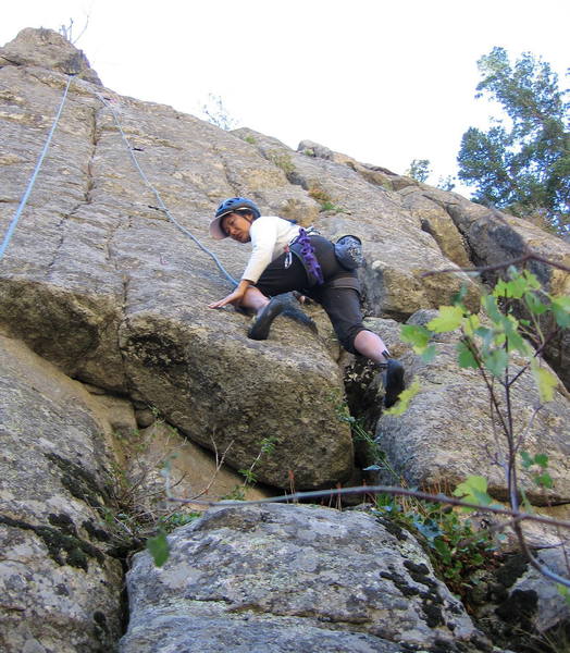 Yvonne D'Andrea starting up Greenback. Her left foot is in the neat hole.