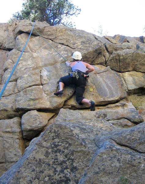 Nickie Kelly climbing the steep wall by the first bolt.