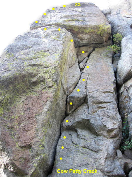 Cow Patty Crack. Climb the corner, traverse left at the horizontal crack, and continue to the chain anchor.<br>
<br>
Short but fun.
