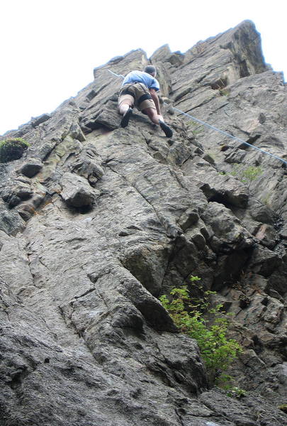 Bob on the airy arete near the top of the route, prior to drilling the bolts.
