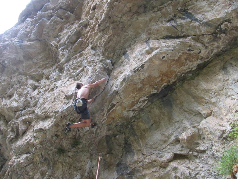 What a cool line through this roofy section!! Burly underclinging! Very very fun!!<br>
Photo by Neil Berget