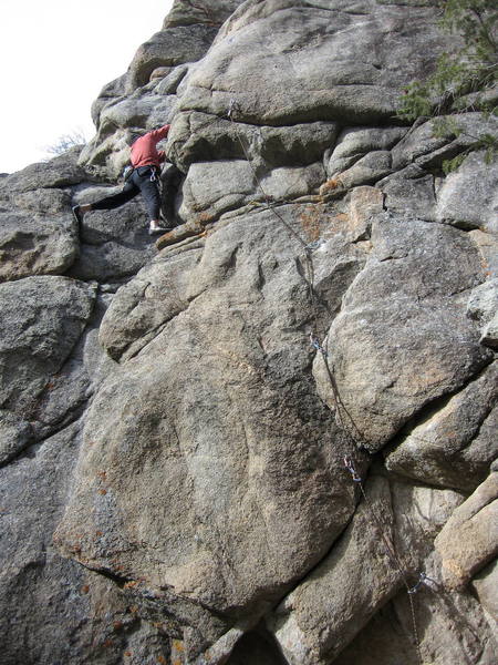 Bob working up the crack left of the fifth bolt.