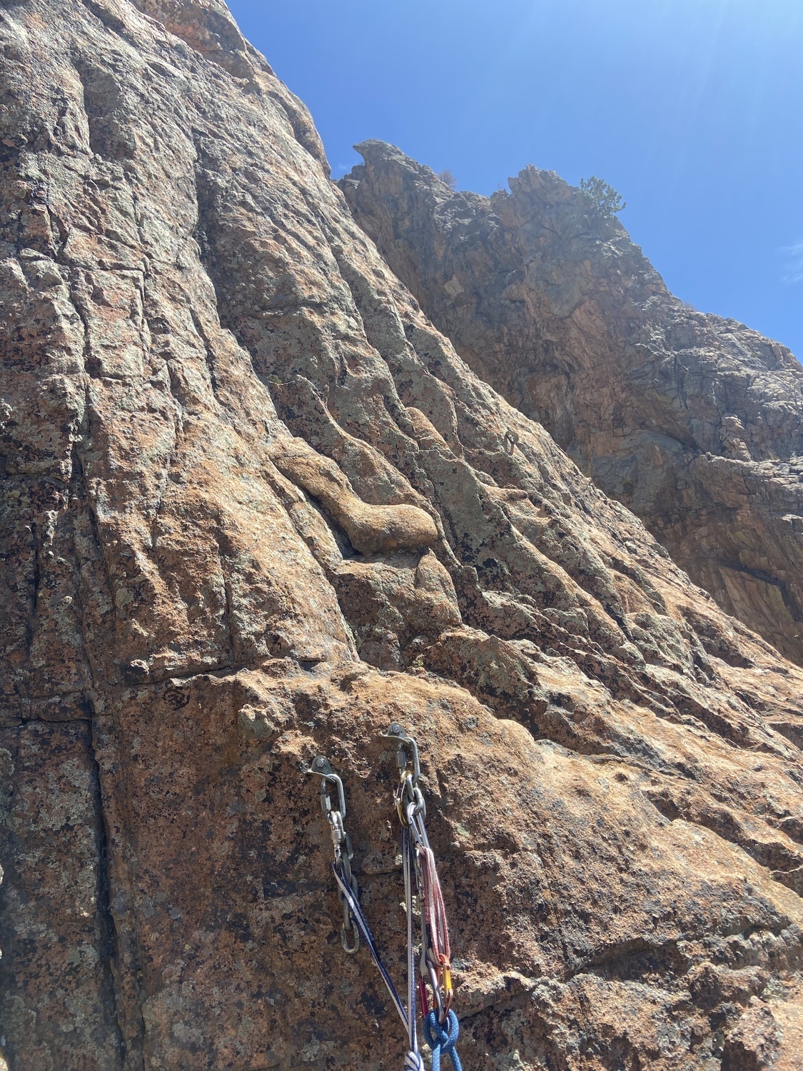 The first belay at large ledge. Climb past the chains visible from the