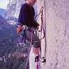 Starting out on 3rd aid pitch above Dinner Ledge, April '78. Eyeing what was probably a 1/4" rivet bolt...