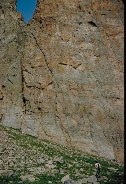 Lower east face of Ptarmigan Tower 2. Tundra Turkey Crack (5.8) is the clean left-slanting wide crack near the center.