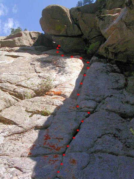 Tunnel of Love. The crux is exiting the crack and stepping left below the roof.