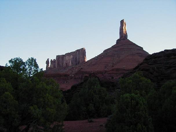Castleton Tower is on the right, The Priest and the Rectory are on the left. Kor-Ingalls climbs the big sunny dihedral on the right side of the tower. Photo: Darin Lang