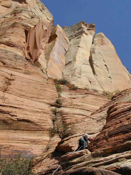 Encountering some 5.7 ground on the slabs (Pitch 8). Isaac's headwall looms above.