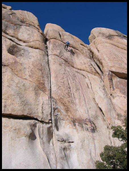Irvin Fernandez raps from the top of the route. Photo: Mike Morley