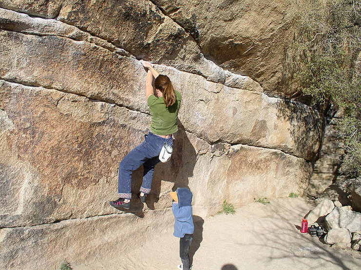 Hannah gives mom a spot as she nears the crux. Copyright 2003, by Randy V.