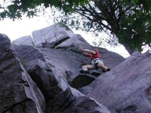 Jan Brown getting up his nerve to step across the void on Pine Tree Step-Across.